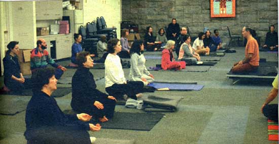 Yoga being taught in New York city by a priest